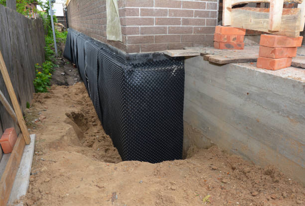 Happy homeowners after waterproofing job in Pennville